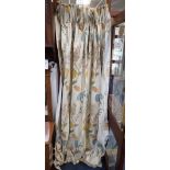 A PAIR OF CREAM FLORAL LINED CURTAINS
