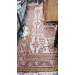 A CREAM GROUND CARPET WITH A PERSIAN STYLE PATTERN, lenth 260, width 190 cm and three smaller rugs