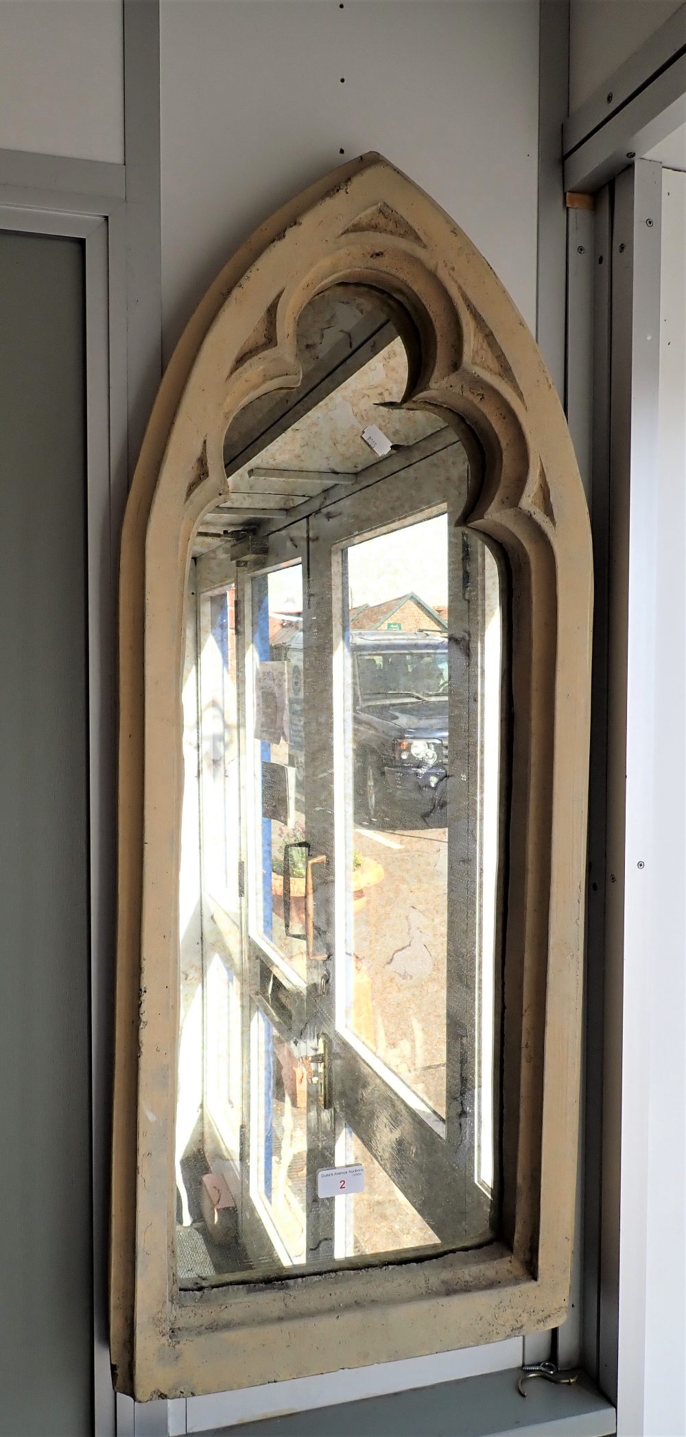 A GOTHIC STYLE RECONSTITUTED STONE GARDEN MIRROR, 90cm high