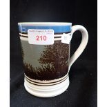 A VICTORIAN MOCHA WARE TANKARD with blue and black bands and a tree design, 12.5cm high