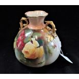 A ROYAL WORCESTER VASE, hand painted with roses, 13cm high