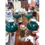 A VICTORIAN STYLE BRASS STUDENT'S LAMP with green glass shades and another similar (2)