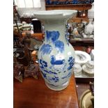 A LARGE CHINESE VASE, hand painted with animals in blue on a pale green ground, 44cm high (examine)