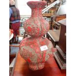 AN ORIENTAL CINNABA RED LACQUERED DOUBLE GOURD VASE, 37cm high