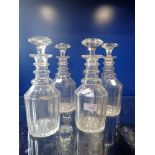 A SET OF FOUR 19TH CENTURY CUT GLASS DECANTERS