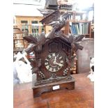 A BLACK FOREST CUCKOO MANTEL CLOCK, 44cm high (working)