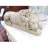 A RECONSTITUTED STONE LION, 32cm long