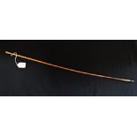 A LADIES RIDING CROP / WHIP , with unmarked engraved yellow metal cap