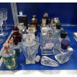 A LARGE COLLECTION OF USED PERFUME BOTTLES