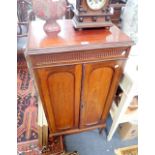 AN EDWARDIAN MAHOGANY MUSIC CABINET, 117cm high x 60cm wide and two boxes of sheet music