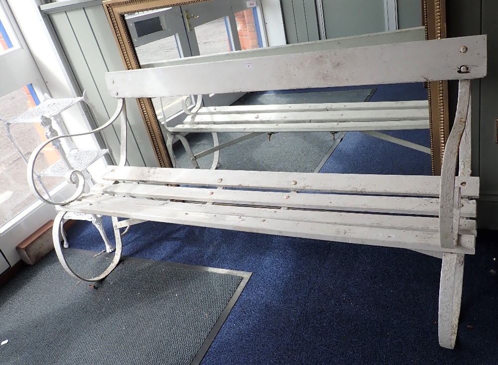 A WROUGHT IRON GARDEN BENCH 155cm long