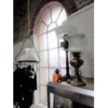 A VICTORIAN HANGING OIL LAMP, similar oil lamps and a brass electrified oil lamp (4)