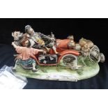 A LARGE CAPODIMONTE STUDY OF A VETERAN CAR, 'Le Disavventure Di Nylord Scultore Tiziano Galli' 48cm