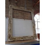 A LARGE VICTORIAN GILT AND PLASTER PICTURE FRAME, height 160cm, width 133cm