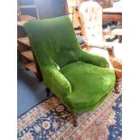 A VICTORIAN CHAIR upholstered in green velvet