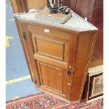 A GEORGE III OAK CORNER CABINET