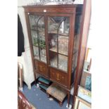 AN EDWARDIAN DISPLAY CABINET WITH MARQUETRY DECORATION, 174cm high x 88cm wide and three foot stools