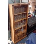 A PINE BOOKCASE fitted with two drawers, 185cm high x 79cm wide