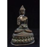 AN ANTIQUE BRONZE BUDDAH, 13cm high