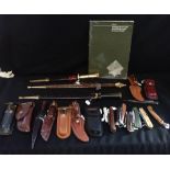 A COLLECTION OF KNIVES, some with leather scabbards, to include hunting knives