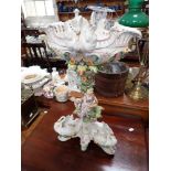 A LARGE EDWARDIAN CONTINENTAL CERAMIC CENTREPIECE decorated with figures and swans, 56cm high