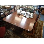 A MAHOGANY BREAKFAST TABLE with central marquetry motif, 114cm wide