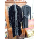 A VINTAGE BLACK VELVET LADIES DRESS, with overcoat, circa 1920s/30s