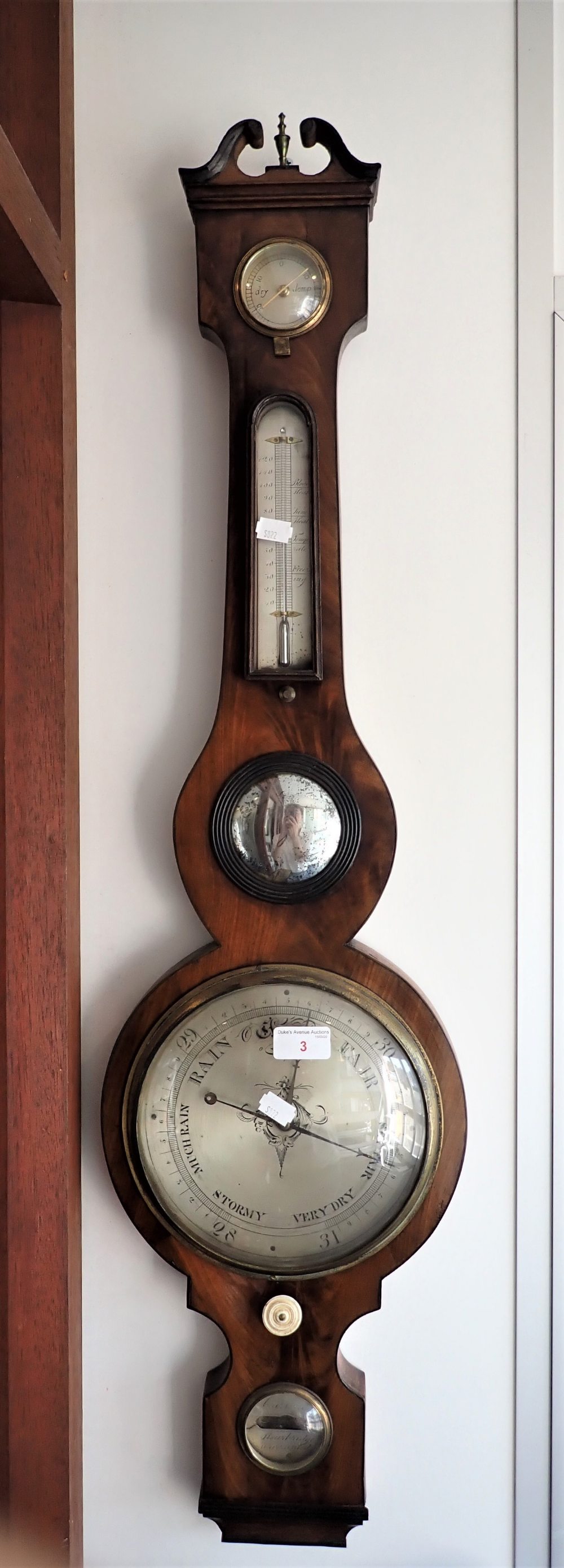 A GEORGE III MAHOGANY WHEEL BAROMETER, the silvered face engraved, 'Cassell' (possibly), Stourbridge