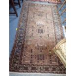 A BROWN GROUND PERSIAN STYLE RUG, length 176cm, width 102cm