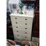 AN EDWARDIAN WHITE PAINTED CHEST OF DRAWERS with tied ribbon and swag decoration, 140cm high x 75cm