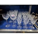 FIFTEEN CUT GLASS WINE GLASSES and seven similar wine goblets