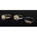 A THREE STONE DIAMOND RING, ring size L, together with two dress rings (3)