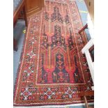 A BLUE GROUND PERSIAN STYLE RUG, length 240cm, width 115cm