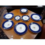 A COLLECTION OF SPODE DINNER WARE decorated with a floral urn within a blue border