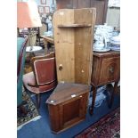 AN OAK CORNER CABINET and a pine kitchen shelf (2)