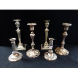 A PAIR OF EDWARDIAN SILVER PLATED CANDLESTICKS
