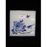 A CHINESE BLUE AND WHITE HAND PAINTED TILE