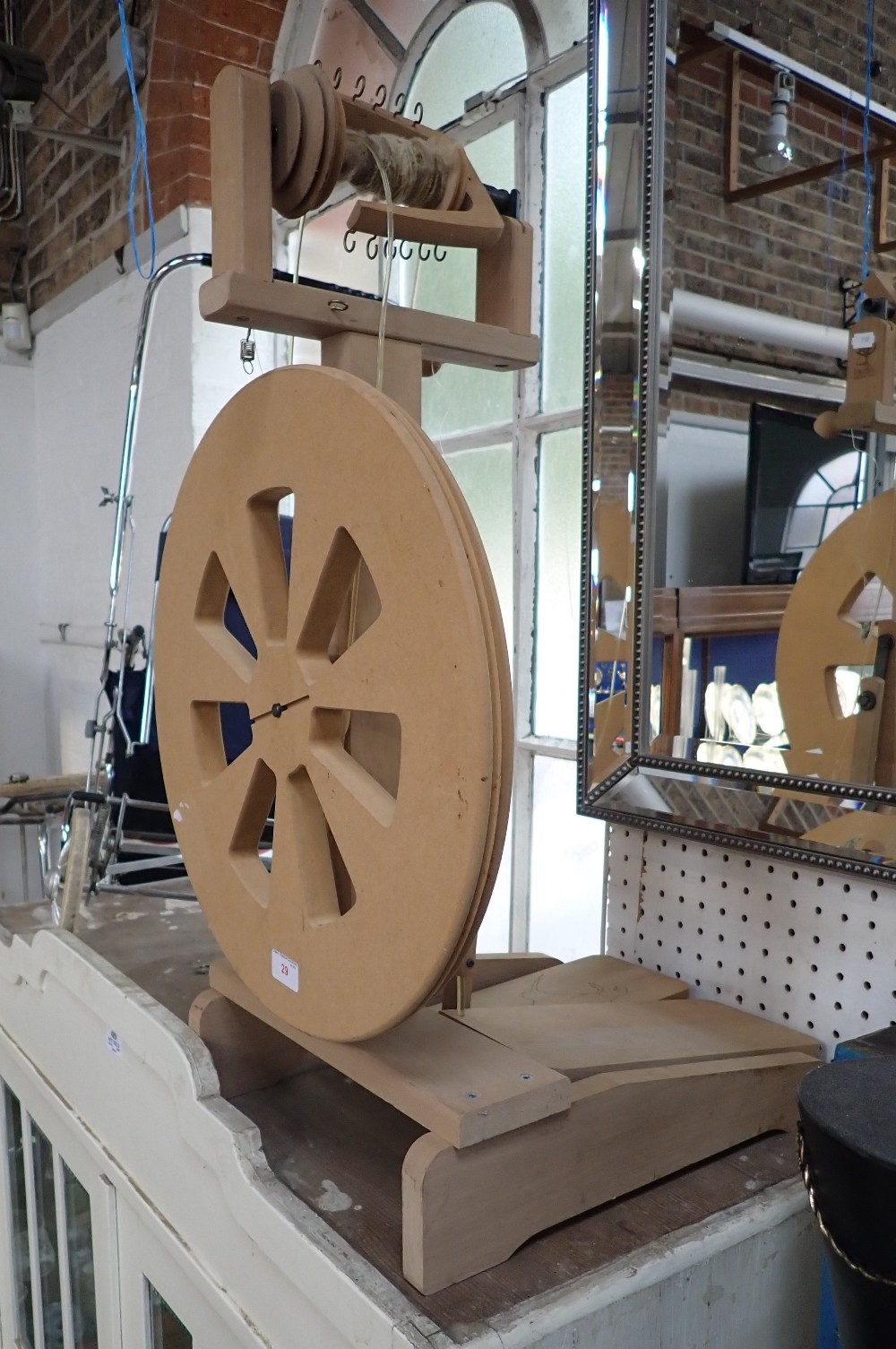 A MODERN BEECH AND MDF SPINNING WHEEL