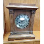 AN EDWARDIAN MANTEL CLOCK WITH SILVERED DIAL