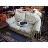 A WESLEY-BARRELL TWO SEATER SOFA OF TRADITIONAL FORM upholstery, 145cms wide