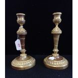 A PAIR OF 19TH CENTURY GILT BRASS CANDLESTICKS