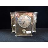 AN EDWARDIAN MANTEL CLOCK WITH SILVERED DIAL