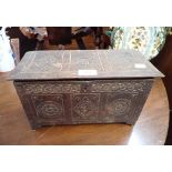A MINIATURE OAK COFFER WITH INCISED DECORATION