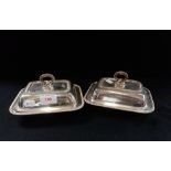 A PAIR OF SMALL SILVER PLATED LIDDED SERVING DISHES