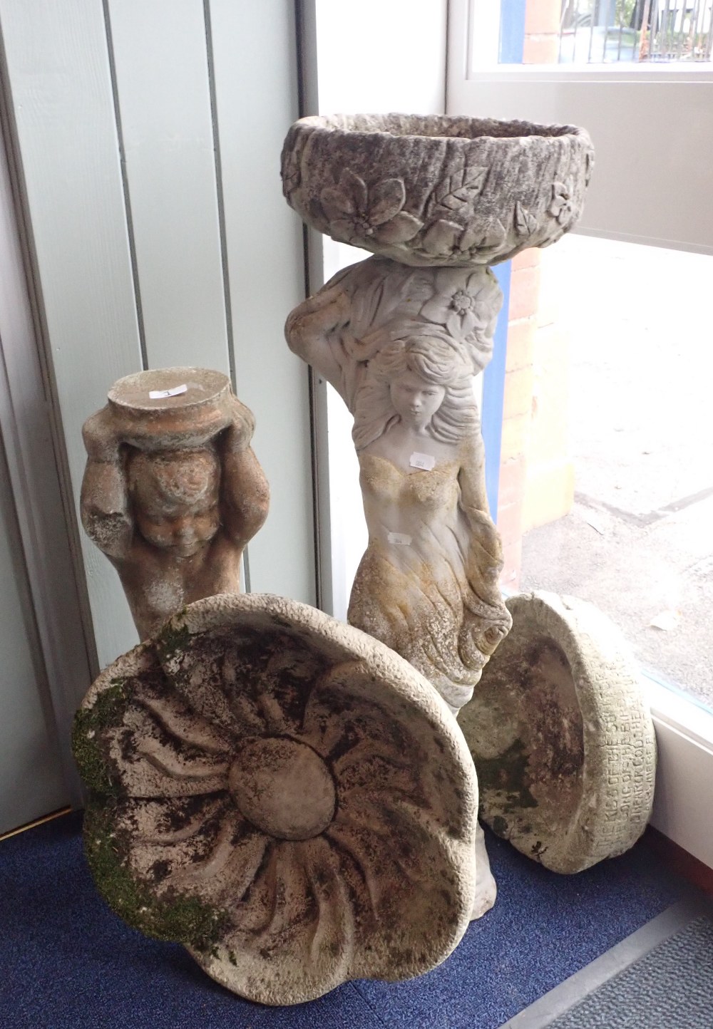 A RECONSTITUTED STONE BIRD BATH