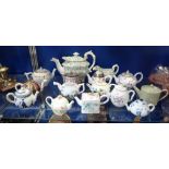 A COLLECTION OF VICTORIA AND ALBERT MUSEUM MINIATURE TEA POTS