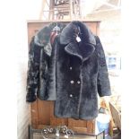 A LADIES SHORT FAUX FUR COAT