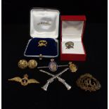 A COLLECTION OF MILITARY BROOCHES