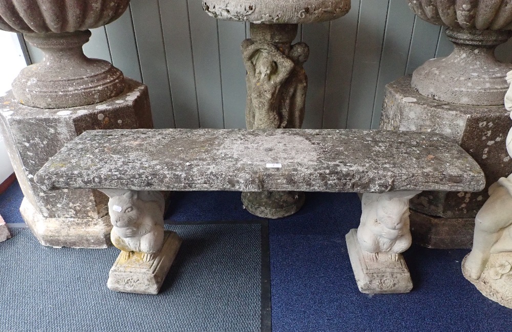 A RECONSTITUTED STONE GARDEN SEAT