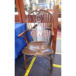 AN 18TH CENTURY YEW WHEEL BACK WINDSOR ARMCHAIR